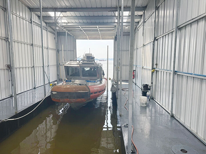 The boathouse is considered a “dry dock” because the boat is stored on a lift above the water.